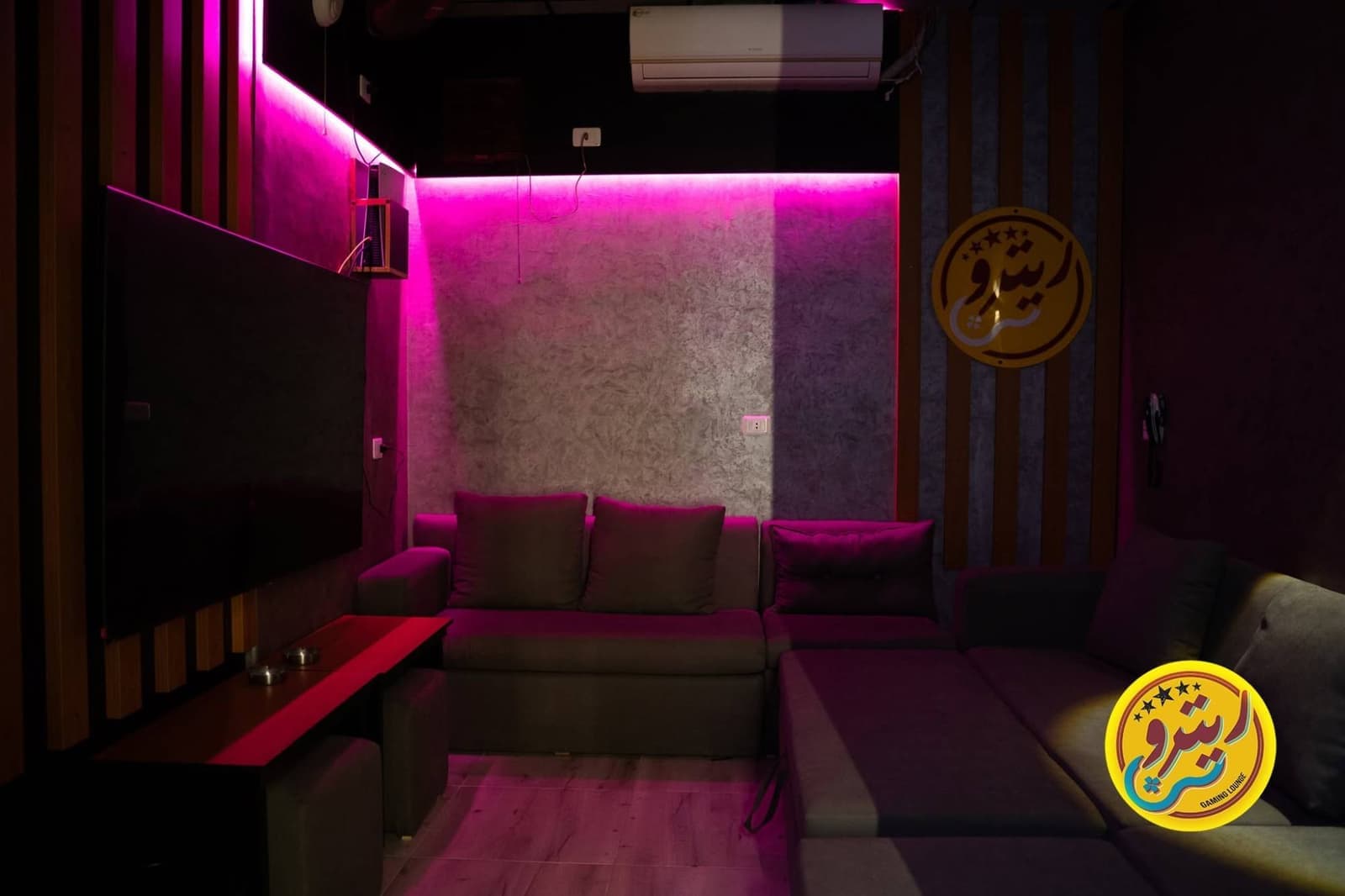 VIP room with a big screen and a sofa